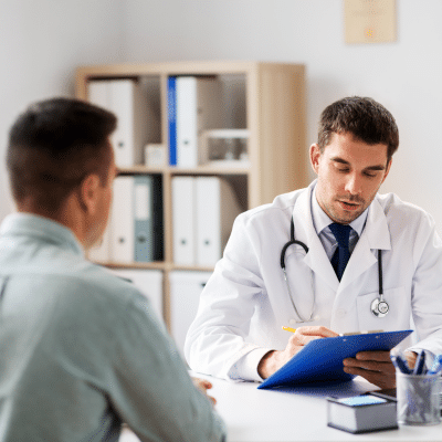 Doctor working one-on-one with a patient, representing physician-managed weight loss