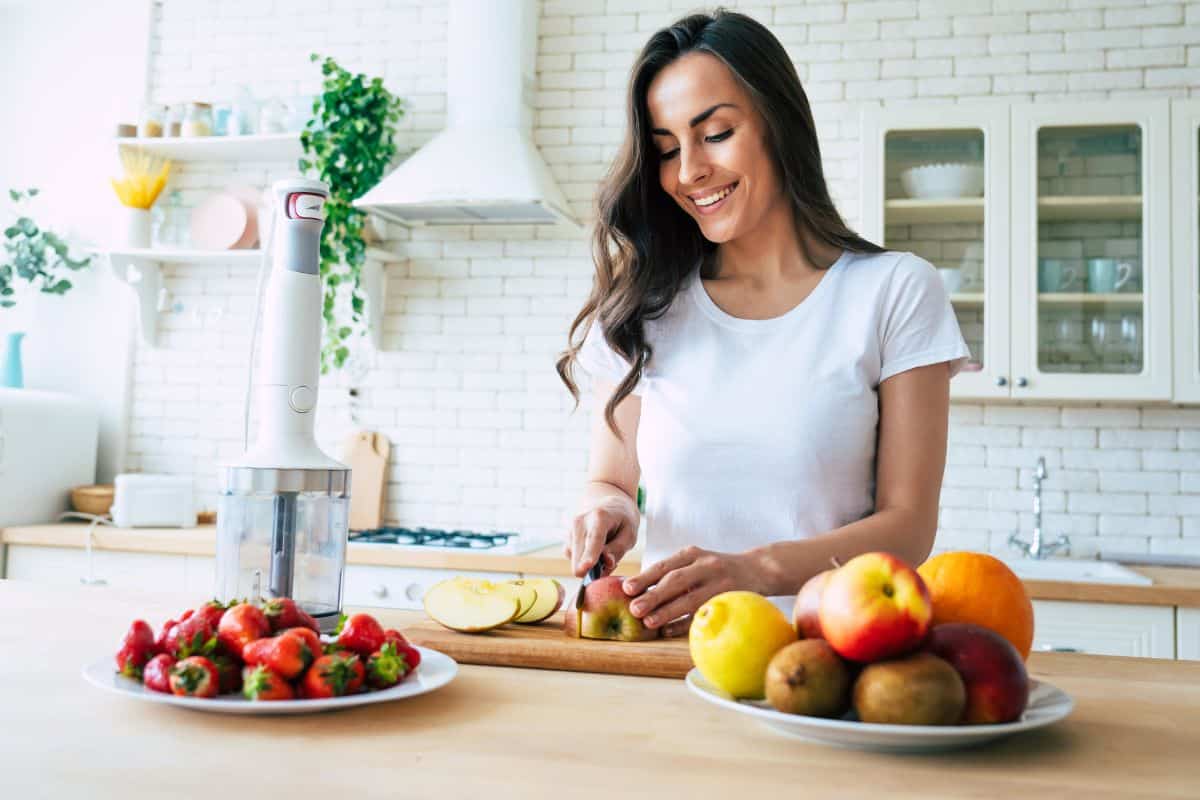 Brunette woman preparing smoothie patient testimonials