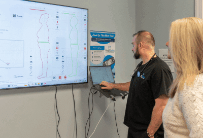 Dr. Justin lindsey meeting with a patient, representing physician-led weight loss